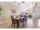 Cozy dining room featuring a wooden table set, neutral walls, and tile flooring at 2246 Cassatt Dr, Henderson, NV 89074