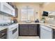 Well-equipped kitchen with white appliances, granite countertops, and ample counter space at 2246 Cassatt Dr, Henderson, NV 89074