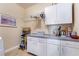 Functional laundry room featuring ample counter space, storage, and a utility sink at 2246 Cassatt Dr, Henderson, NV 89074