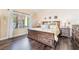 Comfortable main bedroom with hardwood floors, a large window, and tasteful decor at 2246 Cassatt Dr, Henderson, NV 89074