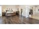 Spacious main bedroom featuring dark wood floors and ensuite bathroom with separate tub at 2246 Cassatt Dr, Henderson, NV 89074