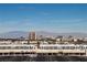 The cityscape features many shops, casinos, hotels, mountains, and a clear blue sky at 2405 W Serene Ave # 817, Las Vegas, NV 89123