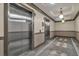 A luxurious elevator lobby featuring two stainless steel elevators and elegant ceiling fixtures at 2405 W Serene Ave # 817, Las Vegas, NV 89123