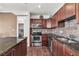 This contemporary kitchen boasts stainless steel appliances, granite counters, and tile backsplash at 2405 W Serene Ave # 817, Las Vegas, NV 89123