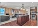 Open concept living and dining area featuring modern decor, bright windows, and dark wood furnishings at 2405 W Serene Ave # 817, Las Vegas, NV 89123