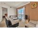 Comfortable living area with city views, modern furniture, and a doorway to a bedroom at 2405 W Serene Ave # 817, Las Vegas, NV 89123