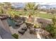 Beautiful backyard features a pool, hot tub, outdoor grill and patio furniture at 2436 Grassy Spring Pl, Las Vegas, NV 89135