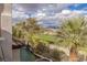 Backyard view showcases golf course and desert landscape with a built-in pool and spa at 2436 Grassy Spring Pl, Las Vegas, NV 89135