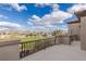 Balcony with views of the golf course, lake, and desert landscape at 2436 Grassy Spring Pl, Las Vegas, NV 89135