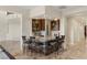 Home bar area featuring a granite countertop, seating for six, and ample shelving for storage at 2436 Grassy Spring Pl, Las Vegas, NV 89135