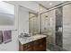 This stylish bathroom features a designer shower and granite countertop at 2436 Grassy Spring Pl, Las Vegas, NV 89135