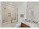 This bathroom is equipped with a shower-tub combo and a granite vanity at 2436 Grassy Spring Pl, Las Vegas, NV 89135