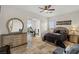 Bedroom suite including workout room, dresser, and closet with dark wood accents at 2436 Grassy Spring Pl, Las Vegas, NV 89135