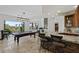 Billiards room with a wet bar and views of the pool at 2436 Grassy Spring Pl, Las Vegas, NV 89135