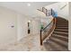 Elegant foyer with a curved staircase, tile flooring, and recessed lighting at 2436 Grassy Spring Pl, Las Vegas, NV 89135