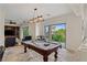 Game room with a pool table and folding door access to the backyard at 2436 Grassy Spring Pl, Las Vegas, NV 89135