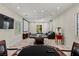 Large game room with a poker table, ping pong table, home theatre, and a vintage popcorn machine at 2436 Grassy Spring Pl, Las Vegas, NV 89135