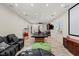 Expansive entertainment area with full bar, home theater, game tables, and comfortable seating options at 2436 Grassy Spring Pl, Las Vegas, NV 89135