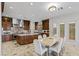 Spacious kitchen with granite countertops, wood cabinetry, and stainless steel appliances at 2436 Grassy Spring Pl, Las Vegas, NV 89135