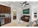 A cozy living area with couches and a kitchenette at 2436 Grassy Spring Pl, Las Vegas, NV 89135