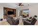 Living room featuring a built-in entertainment center and access to an outdoor sitting area at 2436 Grassy Spring Pl, Las Vegas, NV 89135