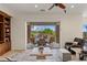 Living room featuring a built-in entertainment center and access to an outdoor dining area at 2436 Grassy Spring Pl, Las Vegas, NV 89135