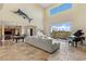 Bright and spacious living room with high ceilings, large windows with backyard views, and comfortable seating at 2436 Grassy Spring Pl, Las Vegas, NV 89135