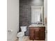 A cozy powder room with modern fixtures and a granite vanity at 2436 Grassy Spring Pl, Las Vegas, NV 89135