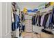 Organized walk-in closet featuring built-in shelves and hanging rods for maximum storage capacity at 2436 Grassy Spring Pl, Las Vegas, NV 89135