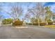 Well-maintained community entrance with mature trees and landscaping at 2501 Foxmoore Ct, Henderson, NV 89052