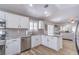 Bright, open kitchen boasts stainless steel appliances, modern fixtures, and views into the living room at 2501 Foxmoore Ct, Henderson, NV 89052