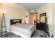 Well-lit bedroom featuring modern decor, dark wood floors, and access to ensuite bathroom at 2700 Las Vegas Blvd # 910, Las Vegas, NV 89109