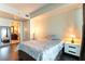 Comfortable bedroom showcasing a nightstand and mirror with a glimpse into the ensuite bathroom at 2700 Las Vegas Blvd # 910, Las Vegas, NV 89109