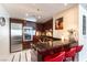 Kitchen with stainless steel appliances, granite countertops, cherry wood cabinets and bar seating at 2700 Las Vegas Blvd # 910, Las Vegas, NV 89109