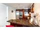 Kitchen with stainless steel appliances, granite countertops, cherry wood cabinets and bar seating at 2700 Las Vegas Blvd # 910, Las Vegas, NV 89109