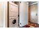 Efficient laundry area with stacked washer and dryer, maximizing space in a modern layout at 2700 Las Vegas Blvd # 910, Las Vegas, NV 89109