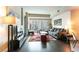 Open living room with modern furniture, hardwood floors and glass doors leading to a balcony at 2700 Las Vegas Blvd # 910, Las Vegas, NV 89109