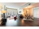 Open living room with modern furniture, hardwood floors and glass doors leading to a balcony at 2700 Las Vegas Blvd # 910, Las Vegas, NV 89109