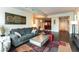 Spacious open floor plan with modern furniture, hardwood floors, bar seating and stainless appliances at 2700 Las Vegas Blvd # 910, Las Vegas, NV 89109