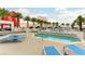 Lounge by the community pool with plenty of seating and palm trees at 2700 Las Vegas Blvd # 910, Las Vegas, NV 89109