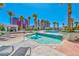 Beautiful pool and spa area surrounded by palm trees, lounge chairs and city views at 2700 Las Vegas Blvd # 910, Las Vegas, NV 89109