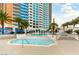 Relax by the community pool and hot tub surrounded by palm trees at 2700 Las Vegas Blvd # 910, Las Vegas, NV 89109