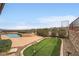 Enjoy outdoor living with pool, spa, putting green, and scenic views from this backyard at 2784 Cherrydale Falls Dr, Henderson, NV 89052