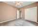 Bedroom featuring plush carpeting, a ceiling fan, a closet, and neutral paint at 2784 Cherrydale Falls Dr, Henderson, NV 89052