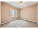 Clean and simple bedroom with neutral walls and carpet at 2784 Cherrydale Falls Dr, Henderson, NV 89052