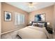 Bedroom featuring a bed, artwork, and a window with vertical blinds for natural light at 2784 Cherrydale Falls Dr, Henderson, NV 89052