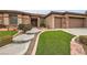 Attractive house with an inviting entryway, manicured lawn, and a convenient three-car garage at 2784 Cherrydale Falls Dr, Henderson, NV 89052