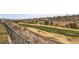 Panoramic golf course views from the backyard area, with desert landscape beyond the fence at 2784 Cherrydale Falls Dr, Henderson, NV 89052