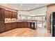 Bright kitchen featuring wood floors, granite counters, and recessed lighting at 2784 Cherrydale Falls Dr, Henderson, NV 89052