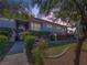 Charming two-story home with landscaped yard and inviting curb appeal, illuminated by soft, ambient lighting at 2867 Geary Pl # 3008, Las Vegas, NV 89109